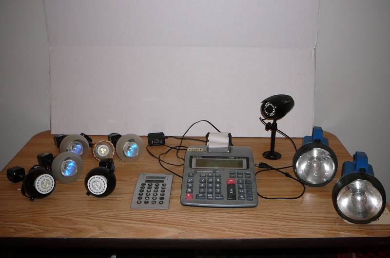 lot 135 image: Flash lights, calculators, night owl cam, track light fixtures