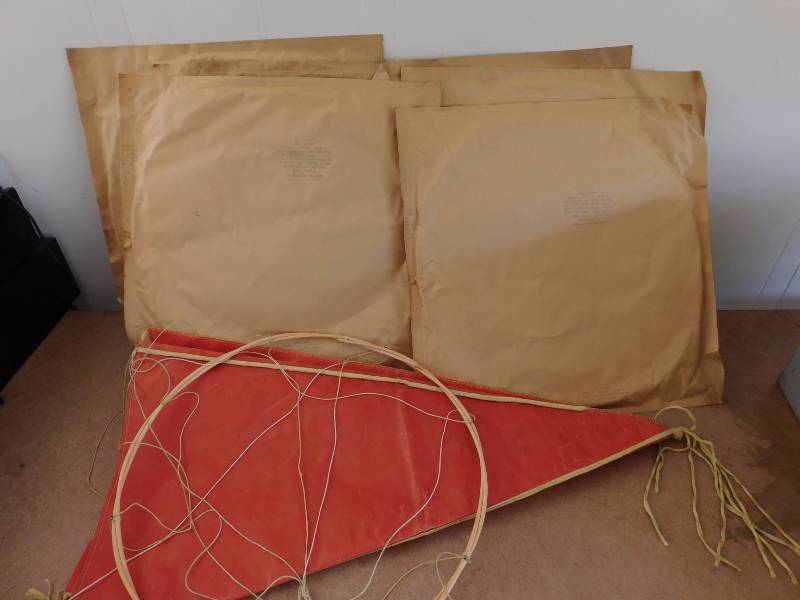 lot 49 image: Vintage 1950s US Army Parachute (1 opened, 6 sealed)