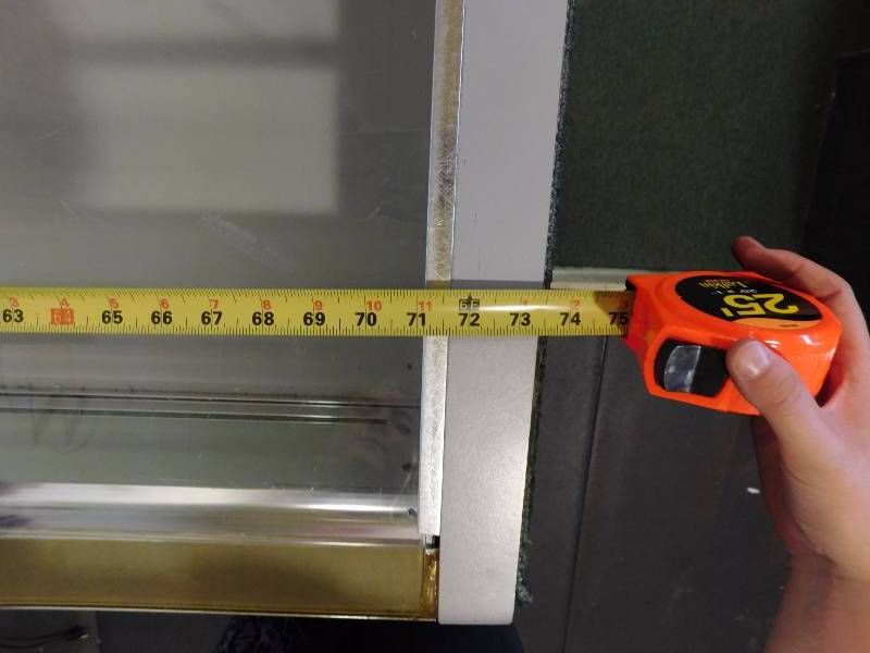lot 131 image: Glass Display Case #1, Green Carpet is Removable Does Not Include Contents (approx. 73.5 x 38 x 22.5)