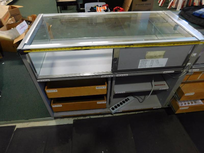 lot 132 image: Glass Display Case #2, Green Carpet is Removable Does Not Include Contents (approx. 48 x 38 x 22.5)