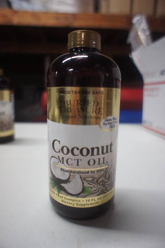 lot 319 image: (Lot of 12) Buried Treasure Coconut Oil MCT - 16 fl oz