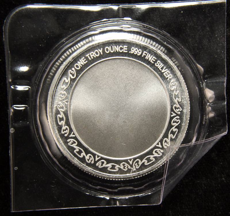 1 TROY OZ. .999 FINE SILVER ROUND WITH CROSS DESIGN SEALED