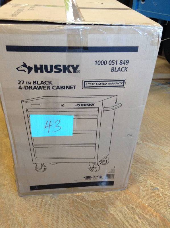 Husky 27 in  4 Drawer Tool Cabinet, not used bottom drawer is dented see pictures