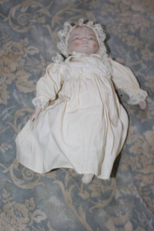 lot 23 image: Baby Doll w Head Scarf, White Gown