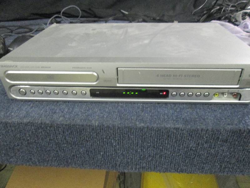 lot 294 image: Magnavox DVDVCR Combo, powers on...