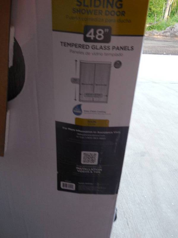 lot 40 image: Delta 60 in. Sliding Shower Door Glass Panels in Rain (1-Pair)