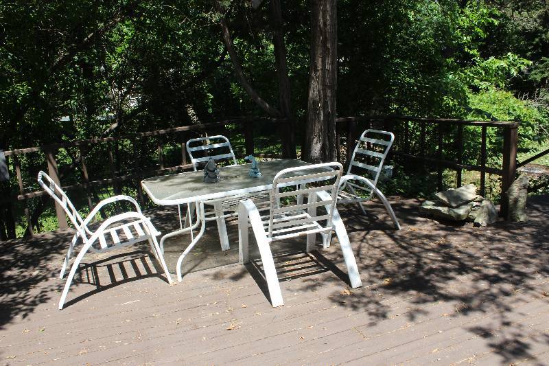 lot 122 image: Glass Top Patio Table, 4-Stacking Patio Chairs