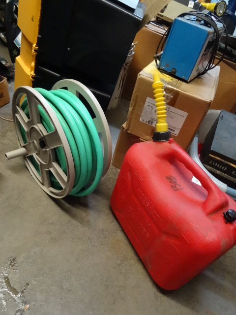 Garden hose and 5 gal plastic gas c...