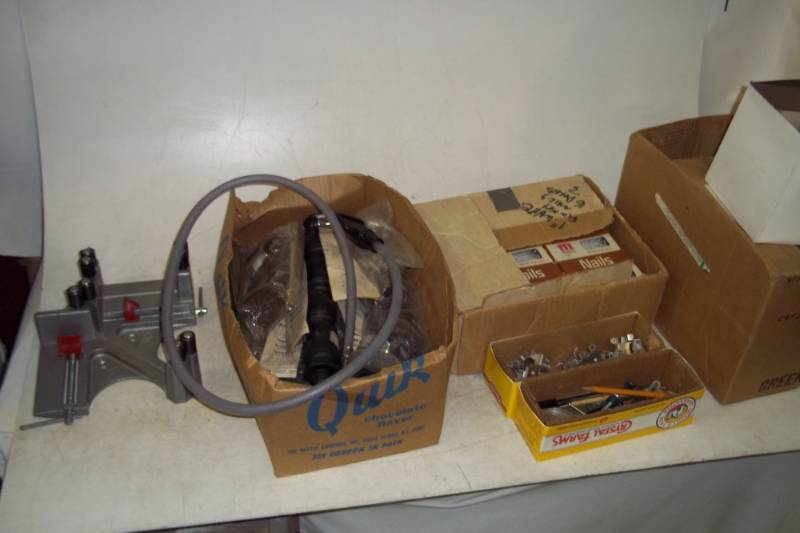 lot 54 image: 16lbs of Interior Nails, Box of Hinges, Faucet Repair Kits, Magnetic Door Latches, Corner Vise
