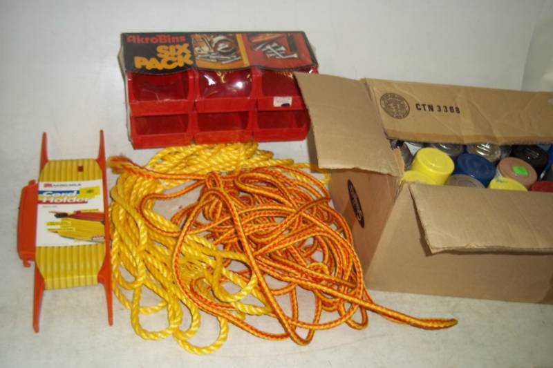 lot 73 image: Box of Assorted Spray Paint, most are mostly full, 6 Pack of Parts Bins, Cord Holder, Rope