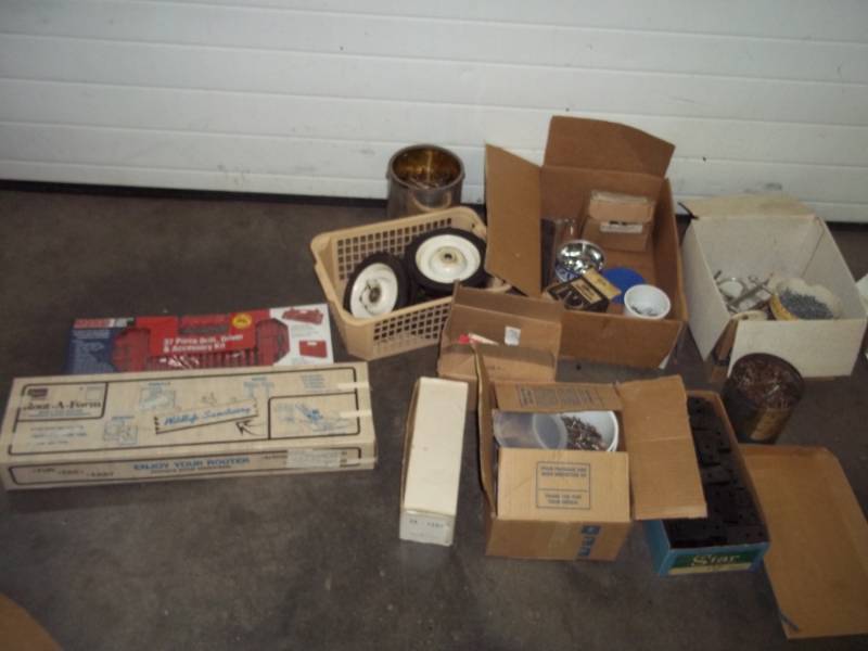 lot 78 image: 12V DCDC Power Pack, Sockets, 37 Piece Drill Driver and Accessory Set, Nails, Rout-A-Form, Small U-Bolts, Assortment Of Training Wheels