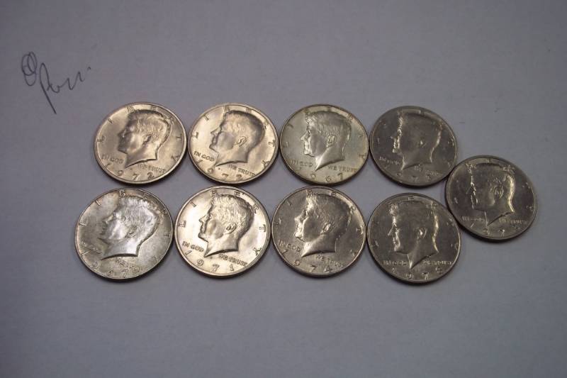 lot 217 image: 9 Half Dollars