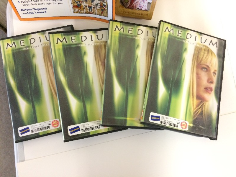 lot 19 image: The Medium First Season DVDs  Tarot Cards & Books