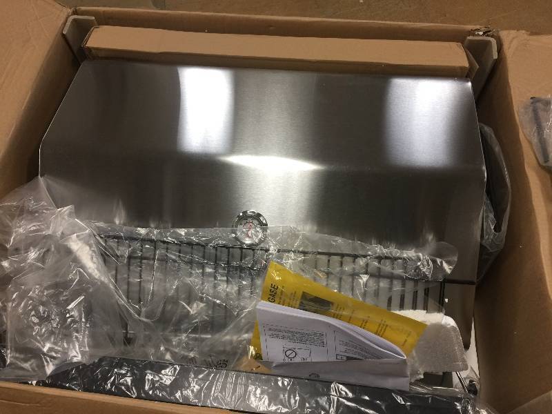lot 11 image: Charbroil 4 burner gas grill with side burner stainless steel model 463433016- damage grate- still usable or could be easily replaced