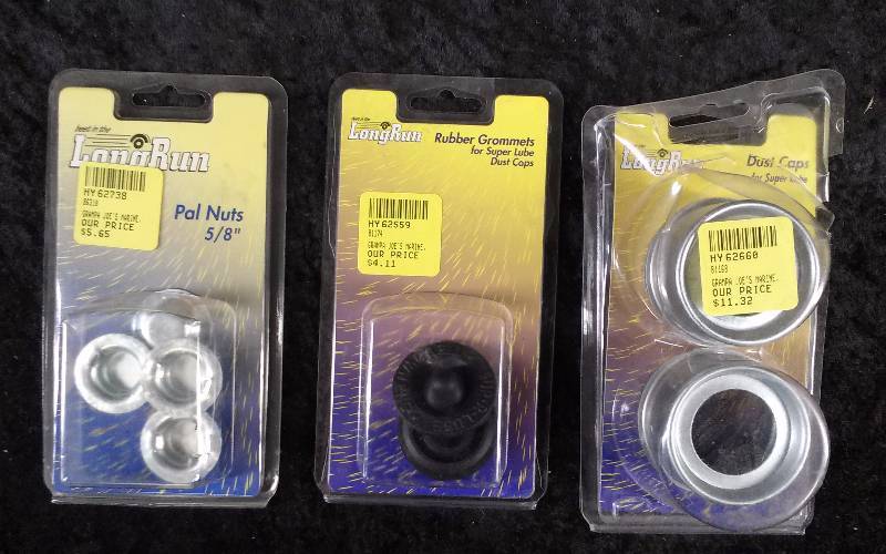 lot 174 image: Lot - Long Run Dust Caps for Super Lube, 58 Pal Nuts, Rubber Grommets for Super Lube Dust Caps