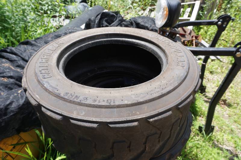 Set of 4 - Caterpillar Brand Skid Loader Skid Steer Tires