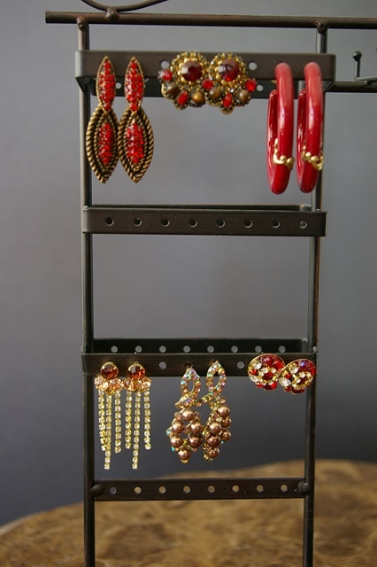 lot 74 image: 12 Pairs of Earrings and 3 Lipstick Holders