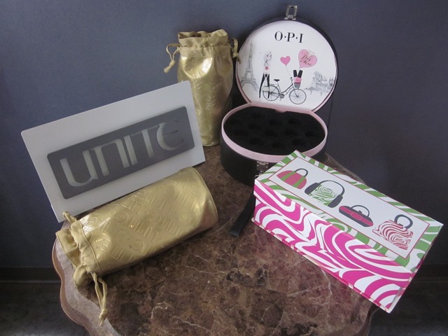 lot 83 image: Empty Containers  Displays OPI Display  Box, Pink Box, Metal Unite Sign, Unite Draw String Bags