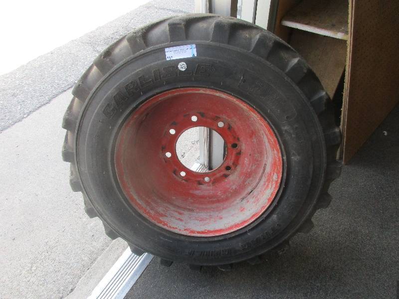 lot 4 image: bob cat tire and rim 10-16.5 tire