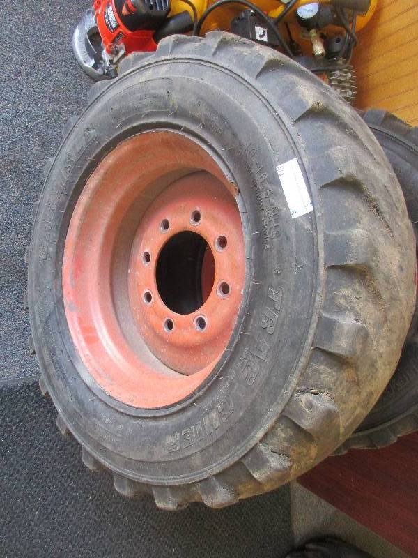 lot 5 image: bob cat tire and rim 10-16.5 tire