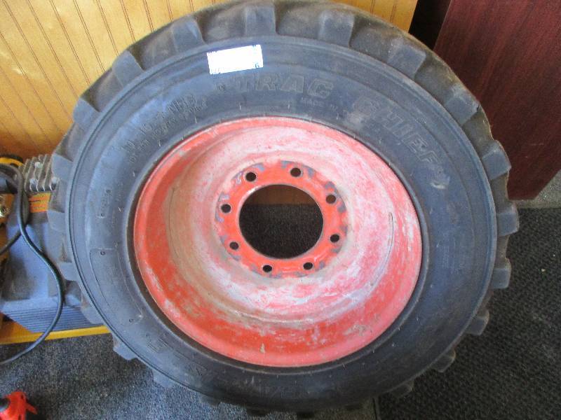 lot 6 image: bob cat tire and rim 10-16.5 tire