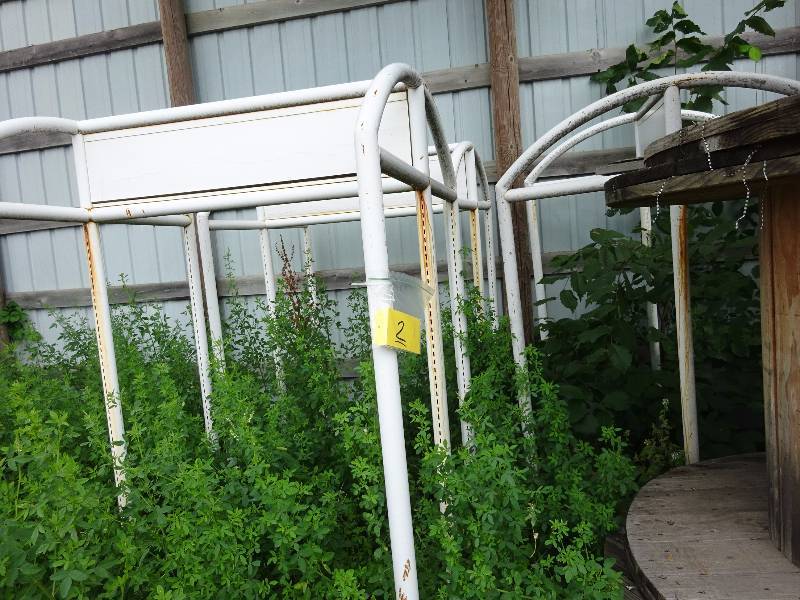 3 white Metal racks
