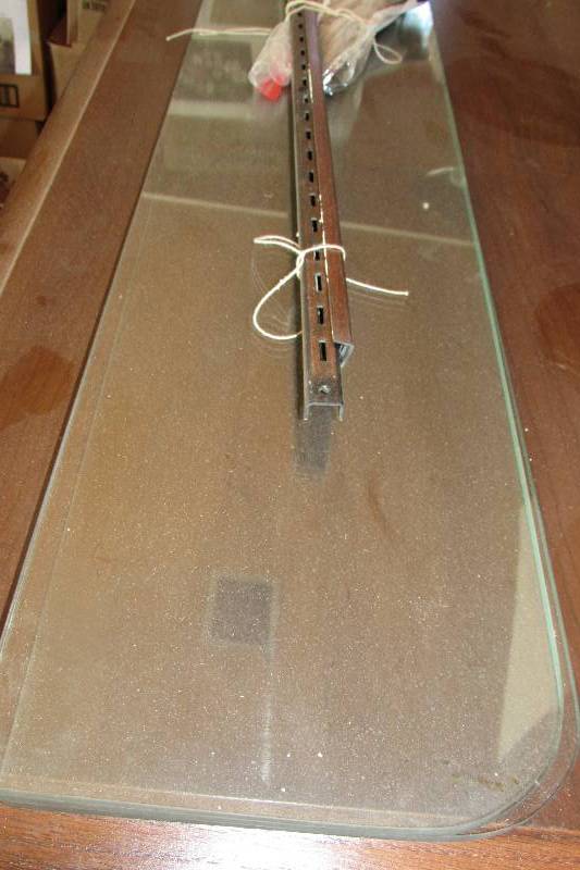 lot 27 image: SET OF THREE GLASS WALL MOUNT SHELVES