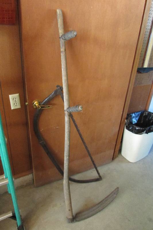 lot 65 image: BOW SAW AND SYTHE
