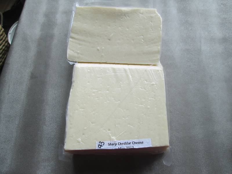 lot 25 image: 9.3 lb.Chunk Sharp Cheddar Cheese P...