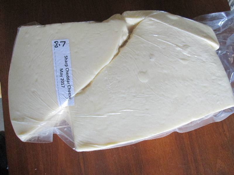 lot 26 image: 8.7 lb.Chunk Sharp Cheddar Cheese P...