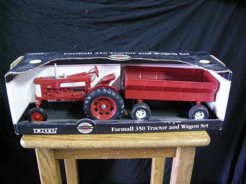 lot 14 image: Ertl Farmall 350 Tractor and Wagon Set