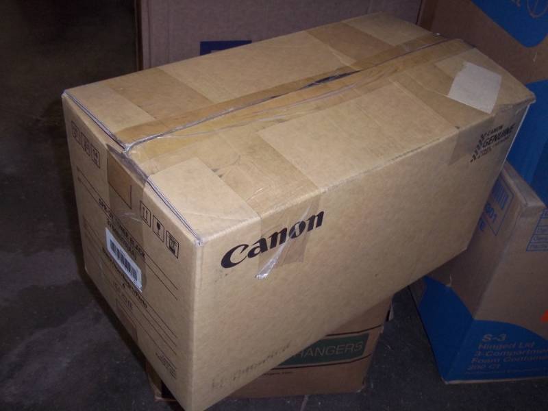 lot 99 image: Cannon Black Toner Box Weighs 40lbs