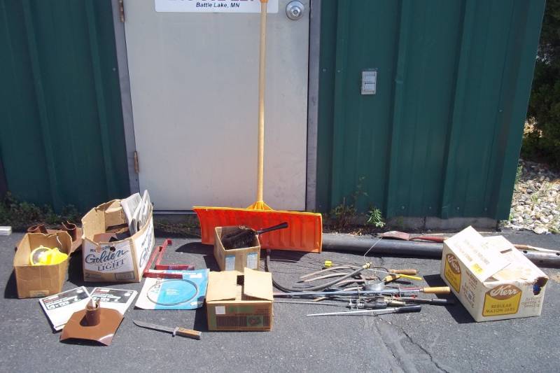 lot 209 image: Snow Shovel, Box of Dock Footpads, Knife, Bandsaw Blades, Nails, STP Oil Treatment, Oil Filter Wrench, Small Spade, Wood Post Assembly Brackets, Lights, Post
