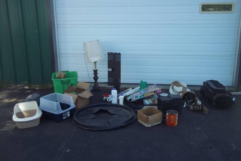 lot 227 image: Golf Clubs with 2 Cases, Lamp, Tree Ring, TV Bracket, Hardware, Speakers, and Litter boxes.