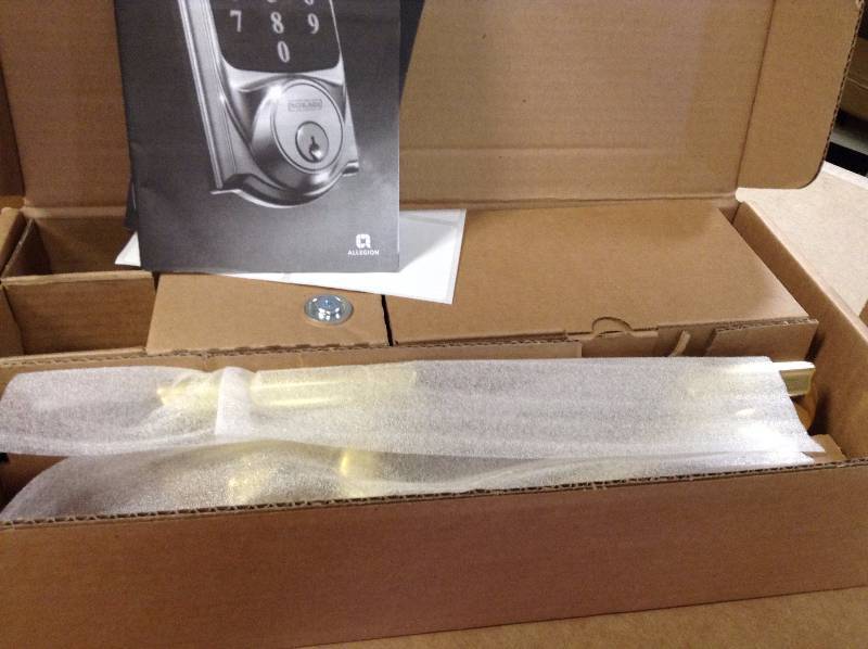 lot 43 image: Schlage Connect Camelot Bright Brass Touchscreen Deadbolt with Alarm and Handleset with Accent Interior Lever open box never used