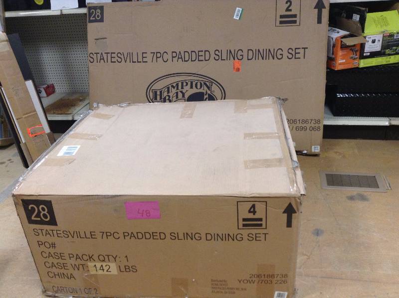 lot 48 image: Hampton Bay Statesville 7-Piece Padded Sling Patio Dining Set open box never used