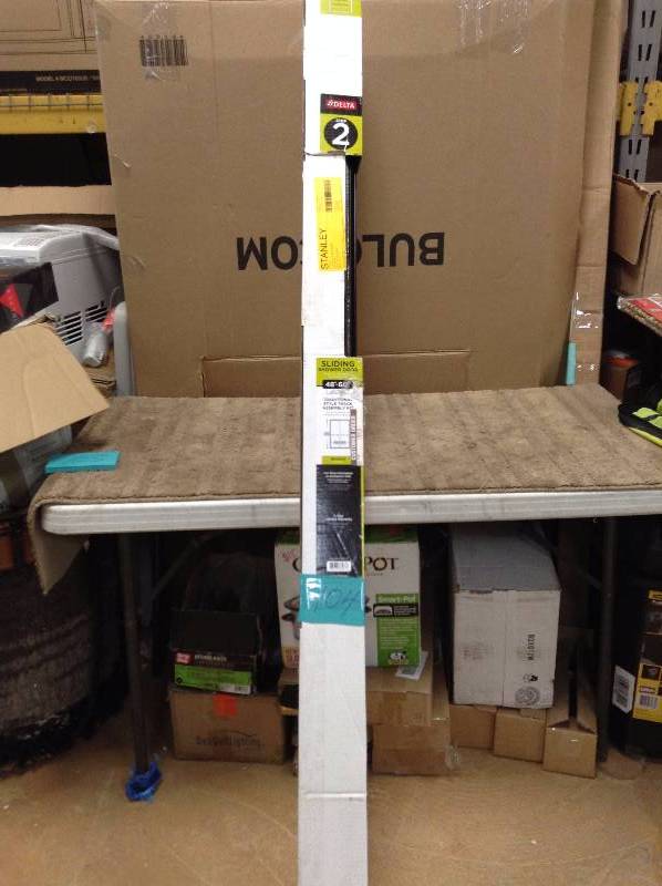 lot 104 image: Delta 48 in to 60 in Sliding Shower Door Track assembly kit in bronze