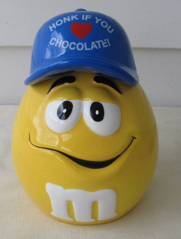 lot 68 image: M & M Candy Canister & Salt & Pepper Shaker Sets
