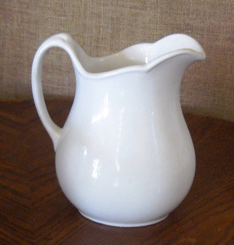 lot 116 image: (3) White Milk  Floral Pitchers