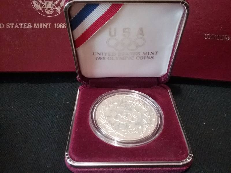 lot 59 image: 1988 90% Silver US Mint Olympic Silver Dollar