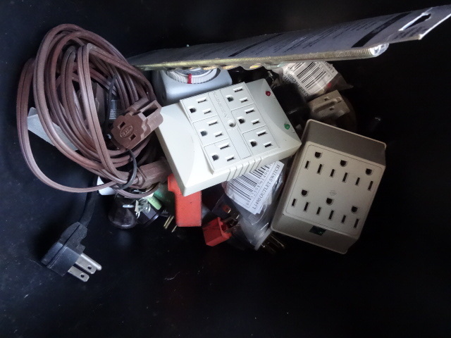 Bin Full of Electrical Timers. Cord Ends. Multi Outlets and More
