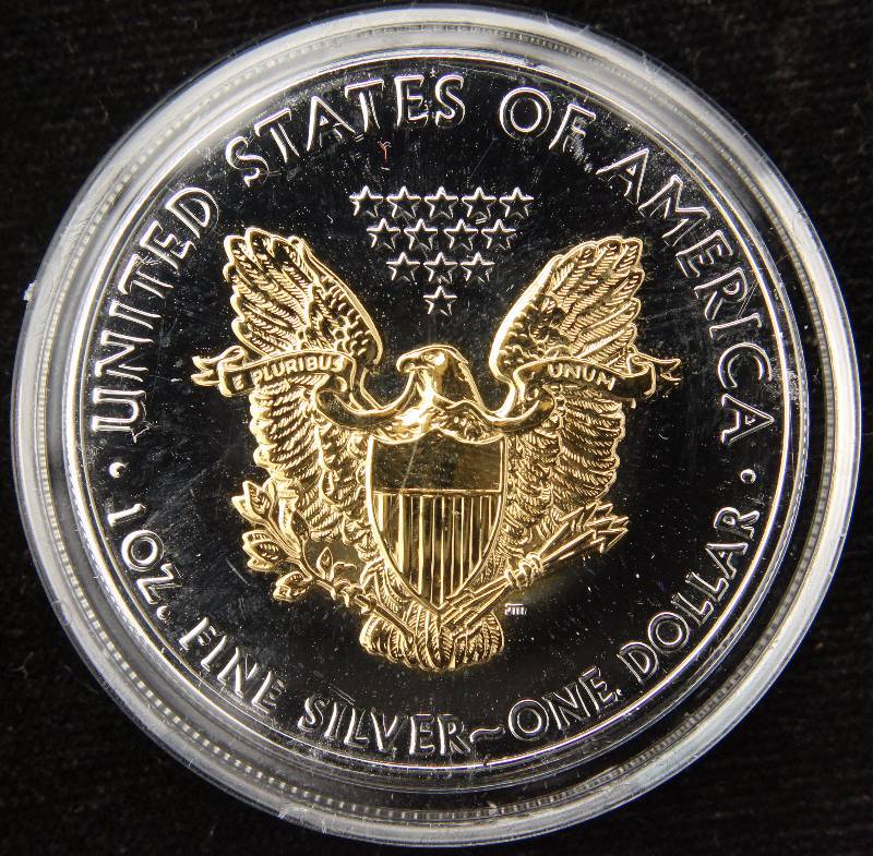 lot 40 image: 2010 COLORIZED AMERICAN SILVER EAGLE 1 TROY OZ. .999 FINE SILVER DOLLAR IN AIRTITE HOLDER