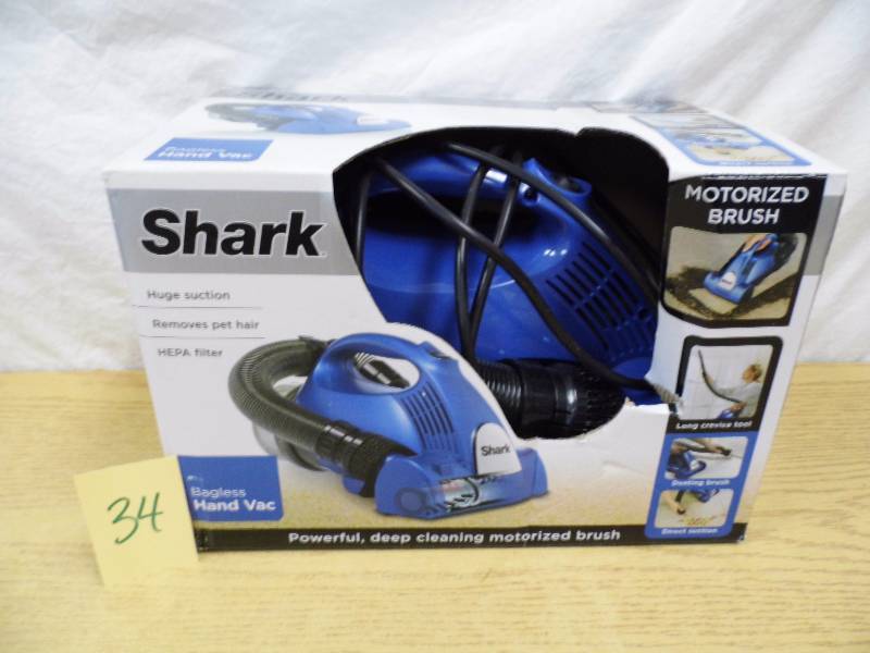 lot 34 image: Shark Hand Held