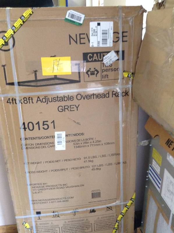lot 17 image: NewAge Products Performance 96 in. L x 48 in. W x 42 in. H Adjustable VersaRac Ceiling Storage Rack in Gray Model#  40151  open box never used