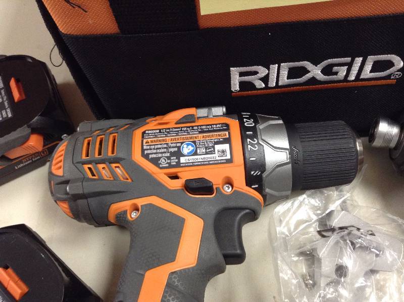 lot 52 image: RIDGID 18-Volt Lithium-Ion Cordless Hammer DrillDriver and Impact Driver Combo Kit model R86008  and R86035 in working conditions