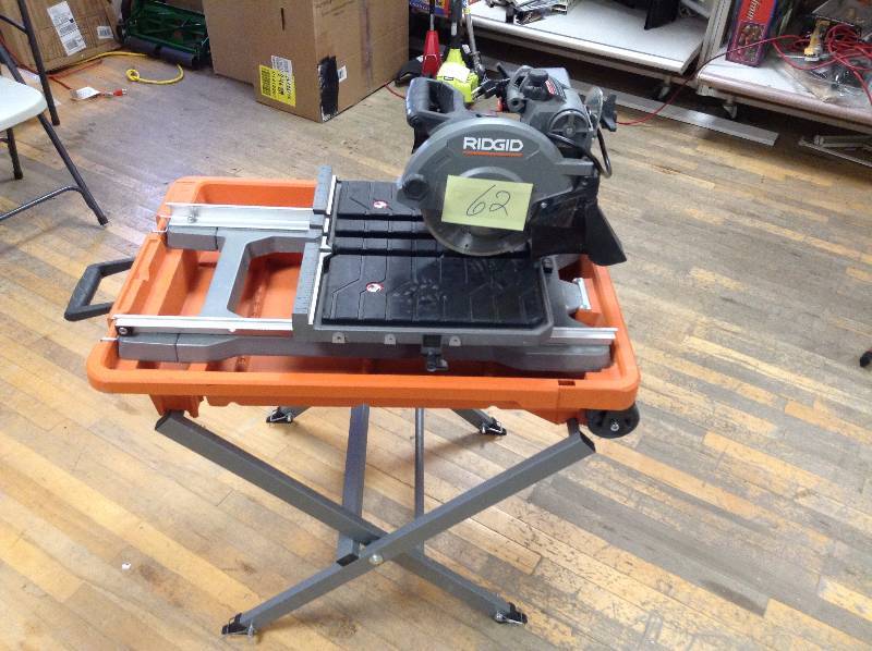 lot 62 image: RIDGID 8 in. Tile Saw with Stand in working conditions