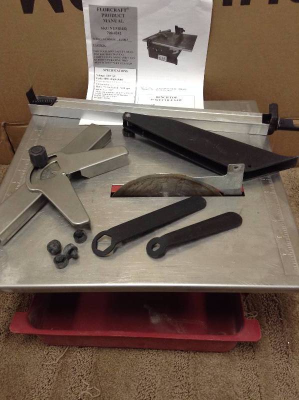 lot 67 image: FlorCraft Bench Top 7 Wet Tile Saw in working conditions