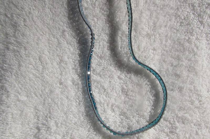 SPOTLIGHT BLUE CRYSTAL AND LEATHER WRAP, MSRP $79.99, 32 LONG