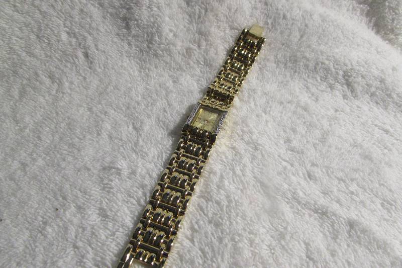 LADIES GENEVE GOLD TONE .05CTT DIAMOND WATCH, MSRP $99.99