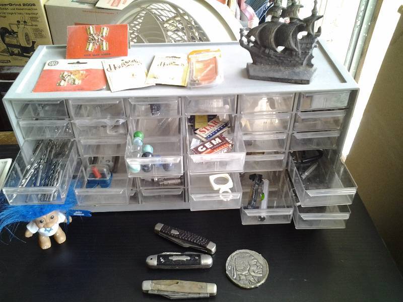 lot 61 image: Organizer & Contents-Drill Bits, Driver Tools, Collectible Pocket Knives, Troll, Marbles, Mini Hrdw.,( Cast Iron Ship)